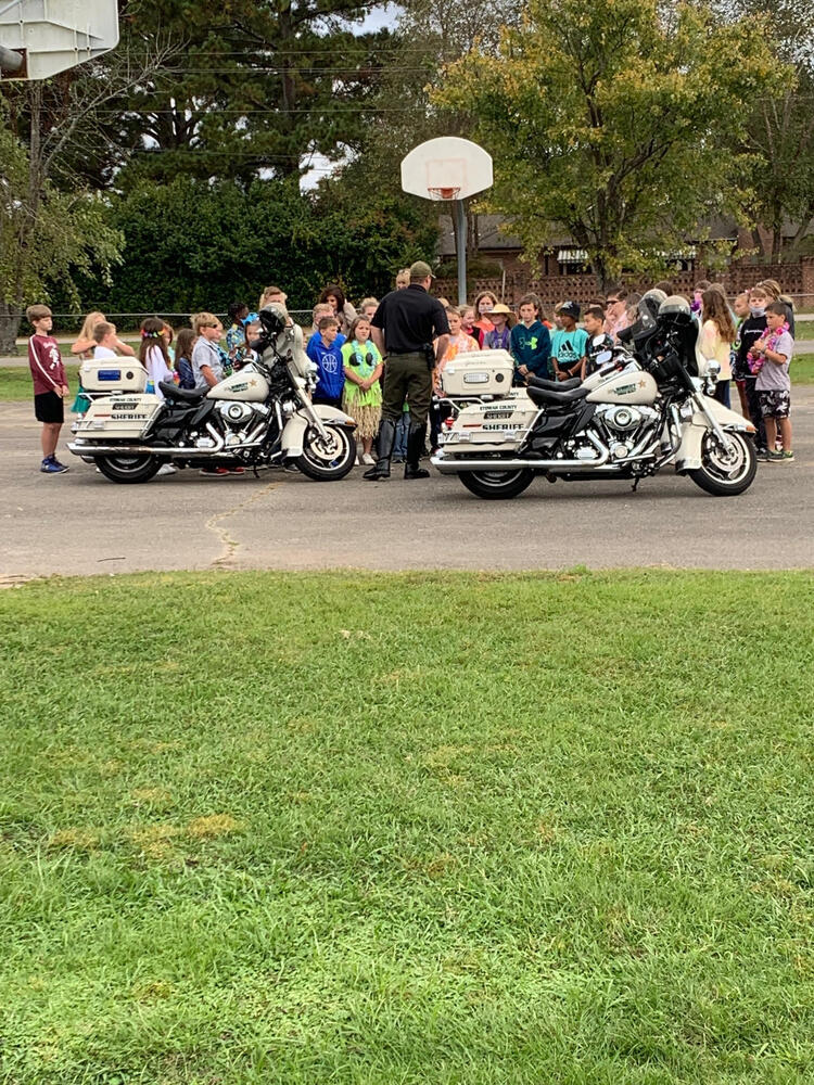 Children viewing patrol bikes