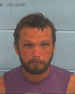Mugshot of KORN, ADAM